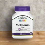 21st century melatonin 5mg is placing on top of kitchen table