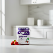 NATROL Melatonin 10mg gummy supplement jar with purple lid on a white background