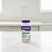 Natrol Time Release Melatonin supplement bottle on a white background