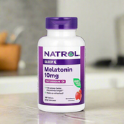 Natrol melatonin fast dissolve 10mg strawberry 100 tablets is placing on top of kitchen table